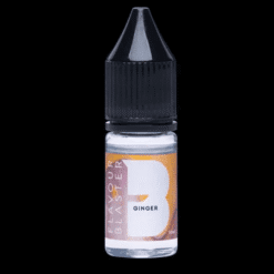 Pistolet générateur de bulles aromatiques turquoise Flavour Blaster posé près d'un petit bol métallique doré