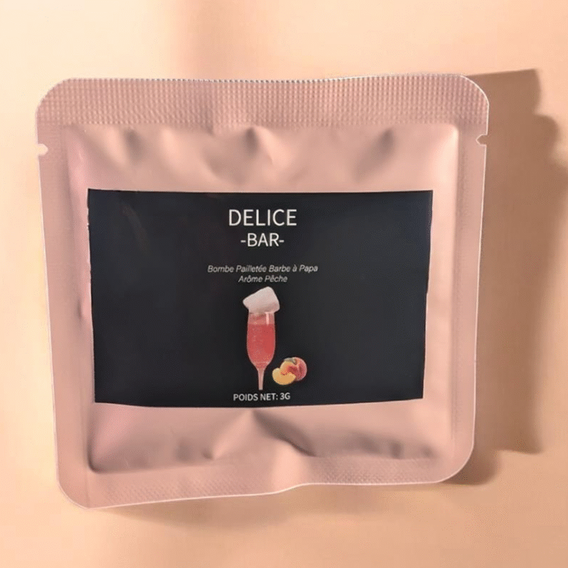 Sachet rose de bombe à paillettes barbe à papa saveur pêche Délice Bar