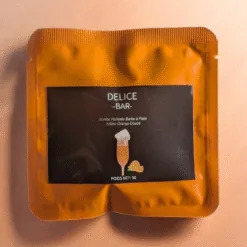 Bombe à paillettes barbe à papa saveur orange douce en sachet orange Délice Bar avec garniture