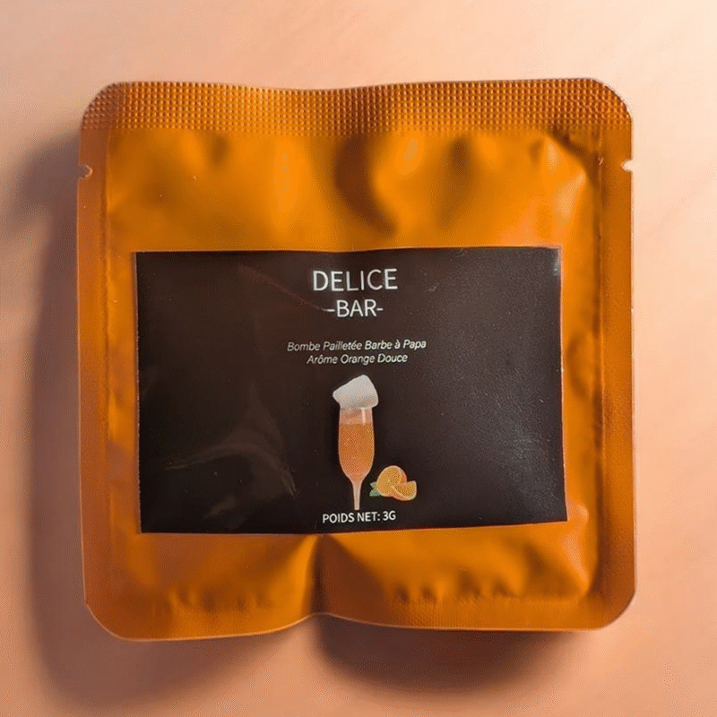 Sachet orange de bombe à paillettes barbe à papa saveur orange douce Délice Bar
