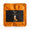 Sobre de bomba de algodón de azúcar con purpurina sabor naranja dulce Délice Bar, con fondo claro.